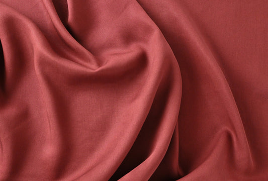 Red fabric draped gently —