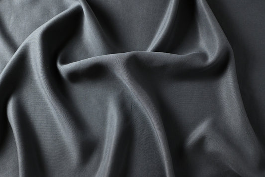 Dark gray fabric draped softly