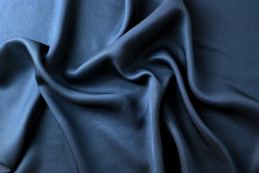 Dark blue satin fabric, rippled
