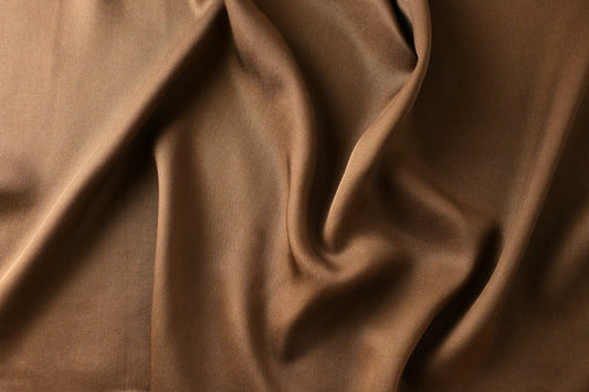 Brown fabric draped gently —